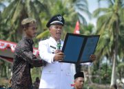 Pemdes Tri Mulya Agung Laksanakan Upacara Pengibaran Bendera Merah Putih Dalam Rangka Memperingati HUT RI ke 79 Tahun